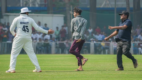 Rohit Sharma Shows Sportsmanship by Embracing Pitch Invader who Breached Security to Meet Him during Ranji Trophy Match